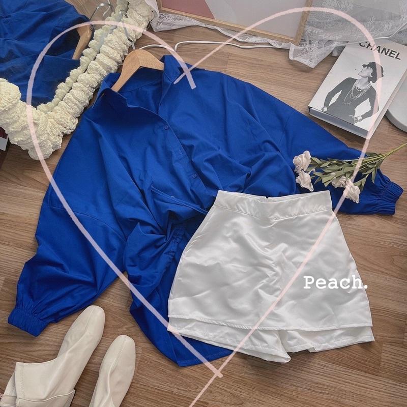 Set áo sơmi xanh tay bo tà lệch phối quần short trắng