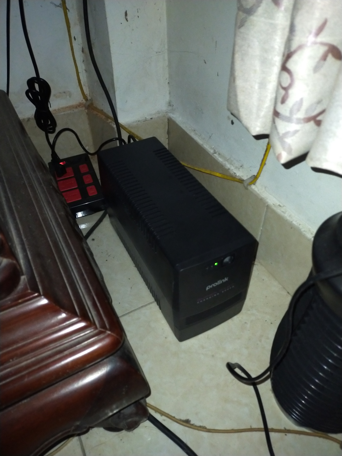 I have been using this UPS for a few days now and have been quite happy about it. I tested its battery function and the device could hold up around 10 minutes before I decided to reconnect it to the electricity.

In my house, I'm using it to protect my computer from sudden power cuts, including three screens and another periphery. Previously, I've calculated that my setup would consume around 340W, so I ordered this UPS just to make sure that it covers everything, including the desk lamp, the WiFi router, and so on. The UPS doesn't make any noises apart from the warning signals when in battery mode and runs smoothly without any issues. During the first few days, it had a slight electronic smell, but this disappeared quickly and is normal anyway, I guess.

So, great product and nothing to complain :)