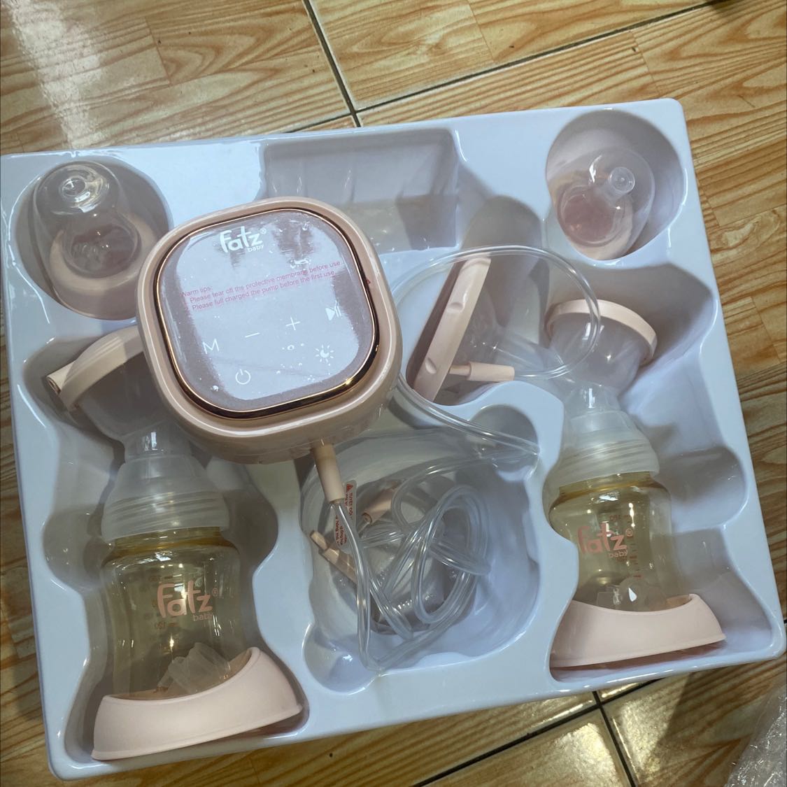 Máy hâm sữa chứ máy hút sữa đâu