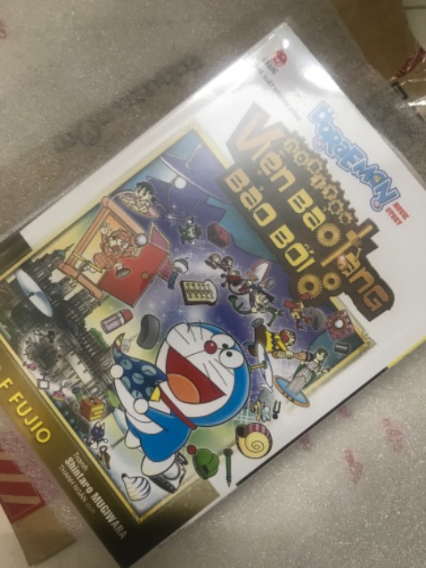 Ship siêu nhanh, truyện bọc đẹp, mua truyện Kim Đồng trên Tiki dịp hội sách này được tăng kèm postcard limited của SpyxFamily, vui ghê luôn