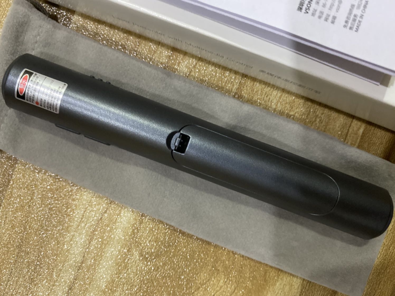 The item was received in about three days after purchase. The product doesn’t look as shiny as advertised, and it feels lighter than expected. Aesthetic aside, the item seems to be working well. Laser pointer function is very strong with a very long range. You must hold the button to maintain the laser. The rest of the buttons are use to control powerpoint. It comes with a storage bag and 1 AAA battery. The instruction booklet only comes in Chinese mandarin. So if you don’t know mandarin it will take a bit of time figuring out, it’s fairly easy to figure out. Or to save time you can visit Vson’s website. They have english instructions on there. The laser doesn’t seem to work on LG smart tv.