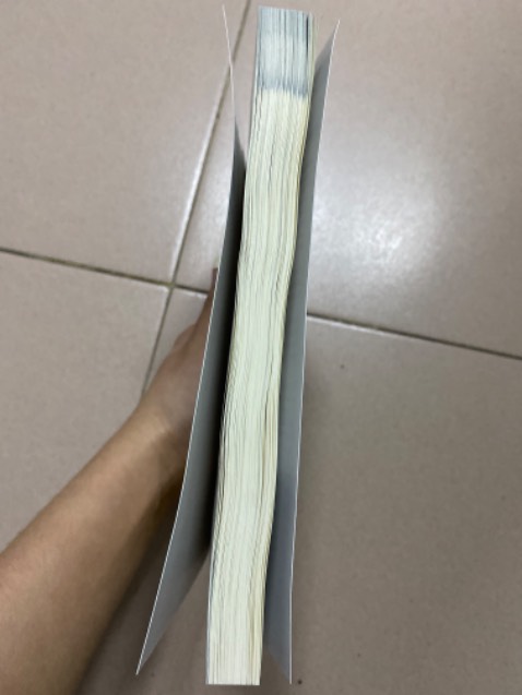 Sách cong vênh, còn dính keo