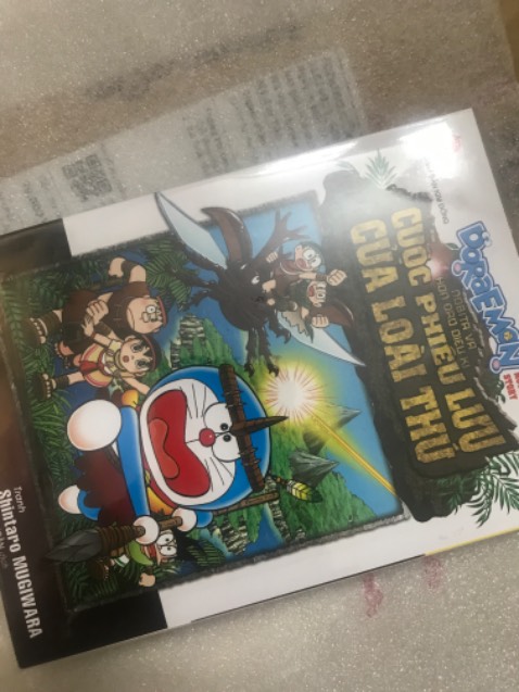 Ship siêu nhanh, truyện bọc đẹp, mua truyện Kim Đồng trên Tiki dịp hội sách này được tăng kèm postcard limited của SpyxFamily, vui ghê luôn